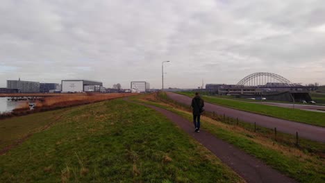 Male-Walking-Along-Path-Beside-Beside-Crezeepolder-Nature-Reserve-At-Ridderkerk-In-Netherlands