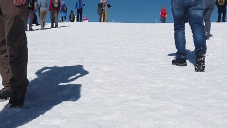 Many-people-walking-on-snow-at-the-top-of-Jungfraujoch