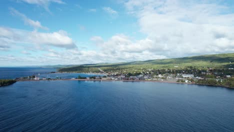 Drone-shot-over-lake-superior-of-Grand-Marais-on-a-sunny-day-in-the-summer