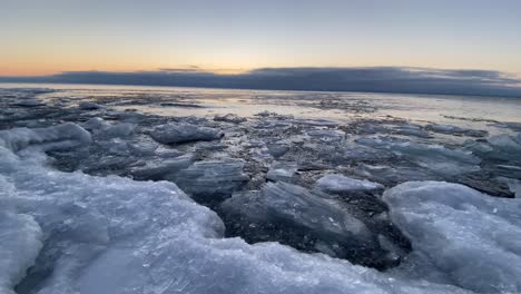 Icebergs-ice-formations-floting-on-water-surface,-Lake-Superior,-winter