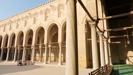 Muslim-woman-at-the-Sultan-al-Mu'ayyad-Mosque-courtyard,-Cairo,-Egypt