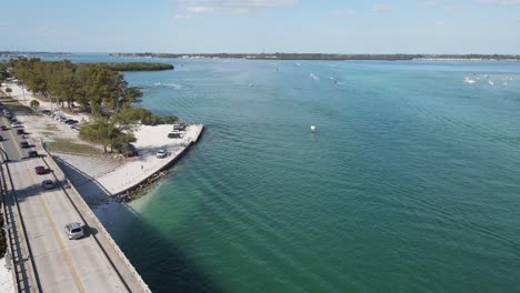aerial-zooming-over-Longboat-Pass-Bridge,-looking-toward-Cortez-from-Longboat-Pass-in-Sarasota,-Florida