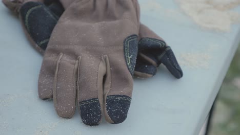 pair-of-carpenter-construction-gloves-on-grey-table