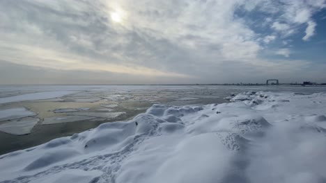 Winter-landscape-lake-superior-frozen,-Canal-park-bridge-Duluth-on-the-background