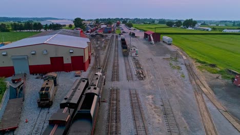 An-Aerial-View-from-Slightly-behind-a-Steam-Passenger-Entering-a-Freight-Yard-heading-Towards-the-Station