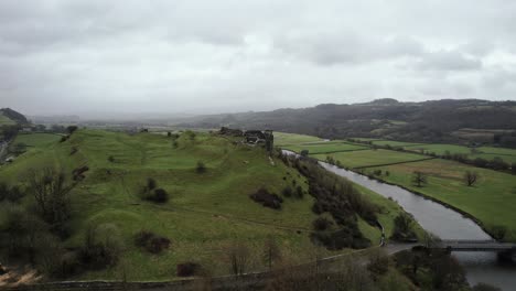AERIAL:-Ascending-shot-of-Dryslwyn-Castle-and-green-valley,-Carmarthen,-4k-Drone