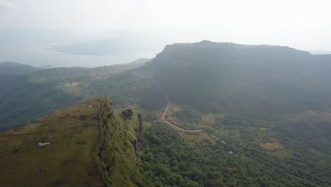 Aerial:-Flat-top-green-mountain-is-home-to-Visapur-Fort-in-misty-India