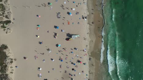 Bird's-Eye-View-Of-Crowded-Beach-During-Summer-Holiday---aerial-drone-shot