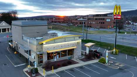 McDonalds-fast-food-franchise-serves-breakfast-coffee-in-drive-thru-at-sunrise-in-USA