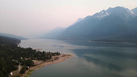 Beautiful-landscapes-of-Kinbasket-Lake-and-the-Rocky-Mountains-during-wildfires-near-Canoe-Reach-in-Valemount,-British-Columbia,-Canada