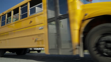 Low-Angle-View-Of-Yellow-School-Bus-Going-Past-In-Punta-Cana-In-The-Dominican-Republic