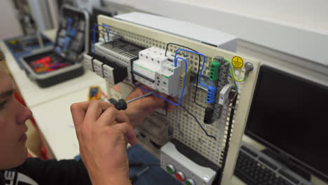 Student-Working-On-An-Electrical-Board-In-Vocational-High-School-Of-Kysucké-Nové-Mesto-Town,-In-Slovakia