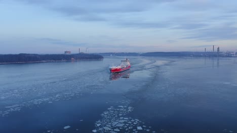 LNG-powered-chemical-and-oil-product-tanker-RAMANDA,-SGRY,-departed-Naantali-oil-refinery-and-making-way-ahead-in-Finnish-archipelago-during-hazy-winter-morning
