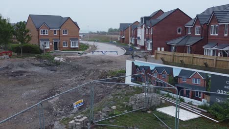 New-subdivision-contractor-incomplete-neighbourhood-housing-construction-site-aerial-descending-view