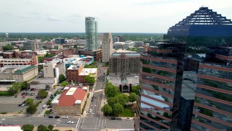 aerial-push-into-durham-nc,-north-carolina-skyline