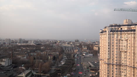 An-aerial-view-overlooking-the-city-of-Odesa-as-cars-and-other-vehicles-passing-the-railway-station-with-ornate-churches-and-the-Black-Sea-in-the-background