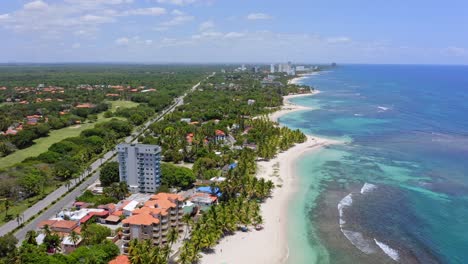 Aerial-riser-reveals-gorgeous-exotic-Caribbean-coastline,-Playa-Juan-Dolio