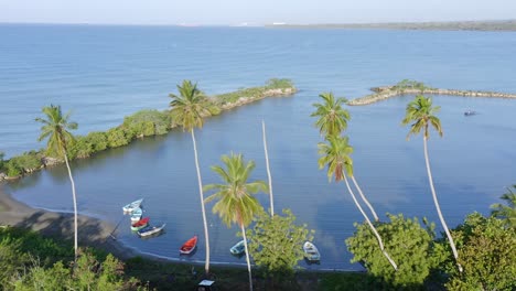Small-boats-anchored-on-bay-of-Soco-river-mouth,-Dominican-Republic