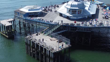 Llandudno-pier-picturesque-Welsh-seaside-holiday-attraction-aerial-view-zoom-in-fishing-jetty
