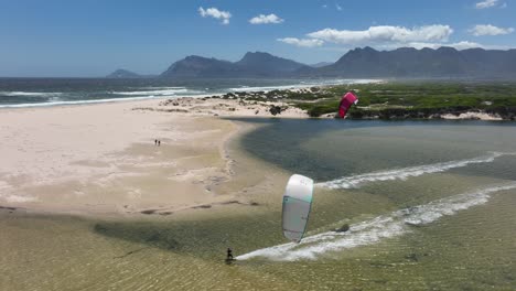 Aerial-Drone-Shot-of-Two-Kitesurfers-on-the-Hermanus-Lagoon-Doing-Tricks