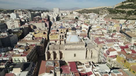 Scenic-Saint-Nicholas-Cathedral-in-Alicante-Downtown,-Aerial-Orbiting-Shot