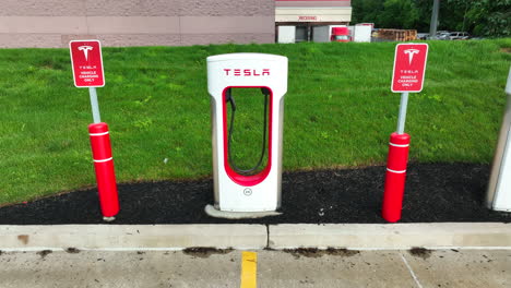 Aerial-rising-shot-with-tilt-down-of-Tesla-Supercharger