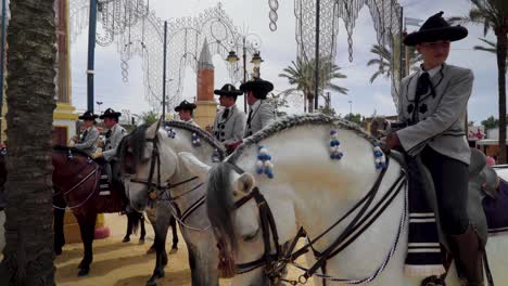 Jinete-riders-chat-on-horses-at-the-fair-in-Jerez-de-la-Frontera,-Spain