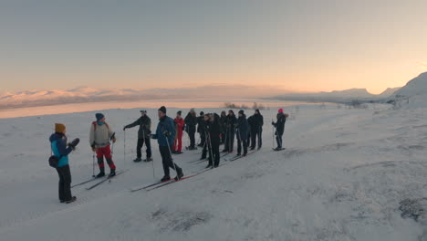Group-of-people-with-cross-country-skis-and-snowshoes-in-northern-Sweden
