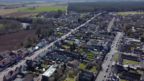 Aerial-view-of-the-Scottish-town-of-Edzell-on-a-sunny-spring-day,-Angus,-Scotland