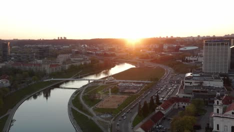 Sun-Casting-Reflection-on-Vilnius-River-Neris-with-Plaza-Full-of-People