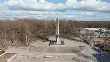 AERIAL:-Darius-and-Girenas-Memorial-on-a-Sunny-Day-near-Azuolynas-Park-with-Brown-Trees