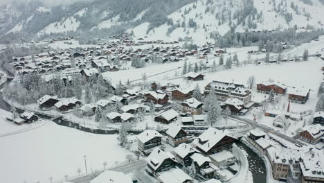 Aerial-of-beautiful-snow-covered-town-in-Switzerland