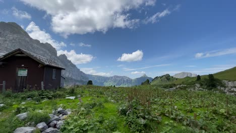 Cabin-in-the-woods-Rautispitz-alps-Switzerland-pan-shot