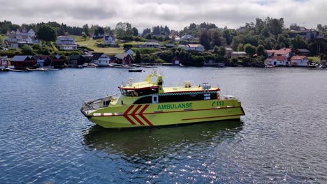 Ambulance-Express-boat-Rygervakt-waiting-to-go-alongside-with-sick-passengers-at-Hjellestad---Norway