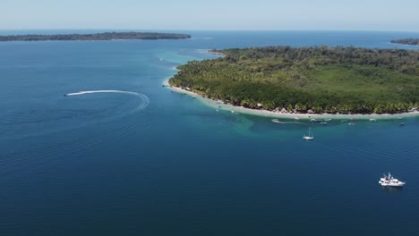 Aerial:-Tourists-enjoy-remote-beach-paradise-on-Bocas-del-Toro,-Panama