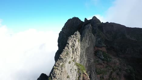 Drone-shot-moving-backwards-along-the-steep-peaks-of-Pico-das-Torres-in-Madeira