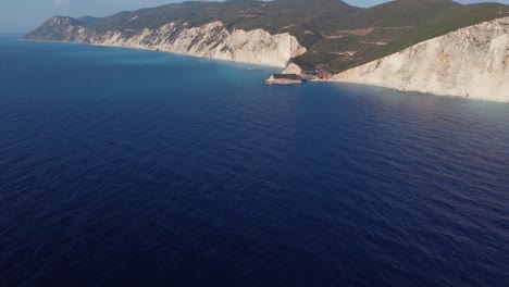 Wide-shot-on-drone-flight-shows-dramatic-cliffs-at-Porto-Katsiki,-Lefkada,-Greece