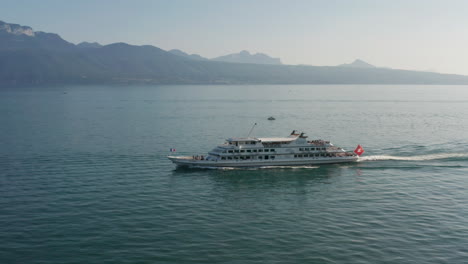 Aerial-of-beautiful-passenger-ship-driving-over-lake-Geneva-in-Switzerland