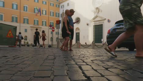 First-person-low-angle-surface-pov-of-tourists-walking-at-Piazza-Della-Minerva-square-in-Rome