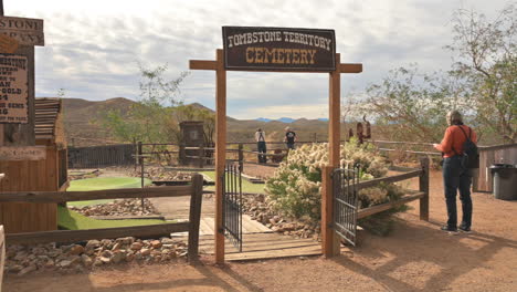 Tombstone-Arizona,-people-at-wild-west-theme-park-with-silver-mining-equipment-and-cemetery
