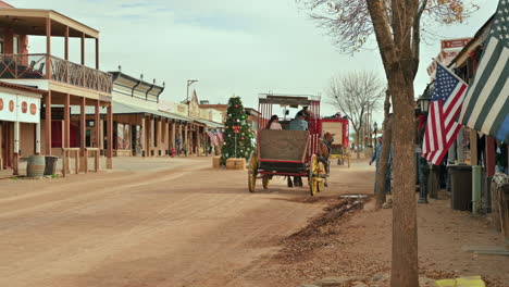 Backside-of-horse-stagecoach-during-Christmas-time,-Tombstone-Arizona,-famous-Allen-Street