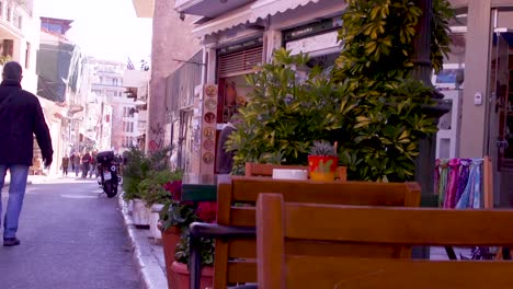 Tables-outside-a-street-cafe-in-Athens,-Greece