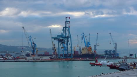 timelapse-footage-of-a-logistic-center-of-a-naval-port-where-cranes-loads-and-unloads-continuously