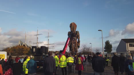 People-walking-behind-Storm-the-Giant-puppet