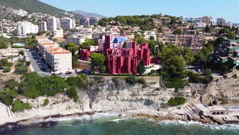 Aerial-view-of-the-colorful-La-Muralla-Roja-building