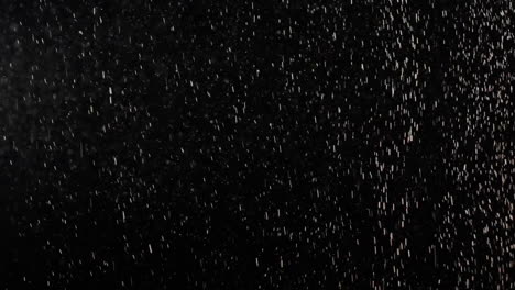 Fallende-Weiße-Schneeschneeflocken-Staubpartikel-Auf-Schwarzem-Hintergrund,-Kalter-Hintergrund-Der-Weihnachtswintersaison