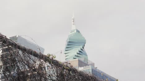 Dolly-shot-revealing-the-spectacular-El-Tornillo-Tower-,-an-award-winning-ultra-modern-architectural-designed-building,-Panama-City