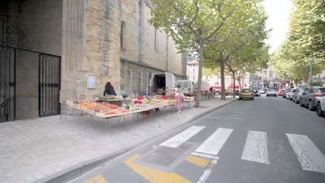 Fresh-produce-market-with-farmer-and-buyer-in-front-of-the-St