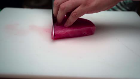 Chef-cooker-slicing-pink-tuna-in-slow-motion-Latin-Mexican-ceviche