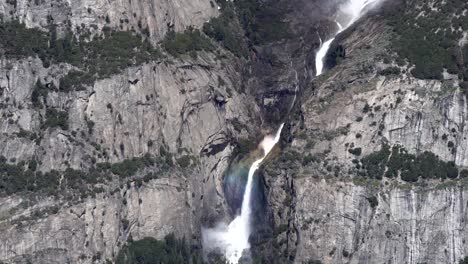 Yosemite-falls-lower-and-upper-views-on-sunny-day,-Tilt-up-reveal-shot